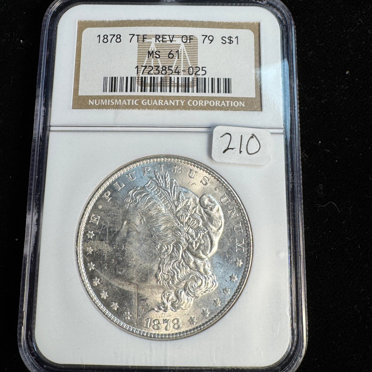 1878 7-TF Rev of ‘79 Morgan Silver Dollar, NGC MS-61