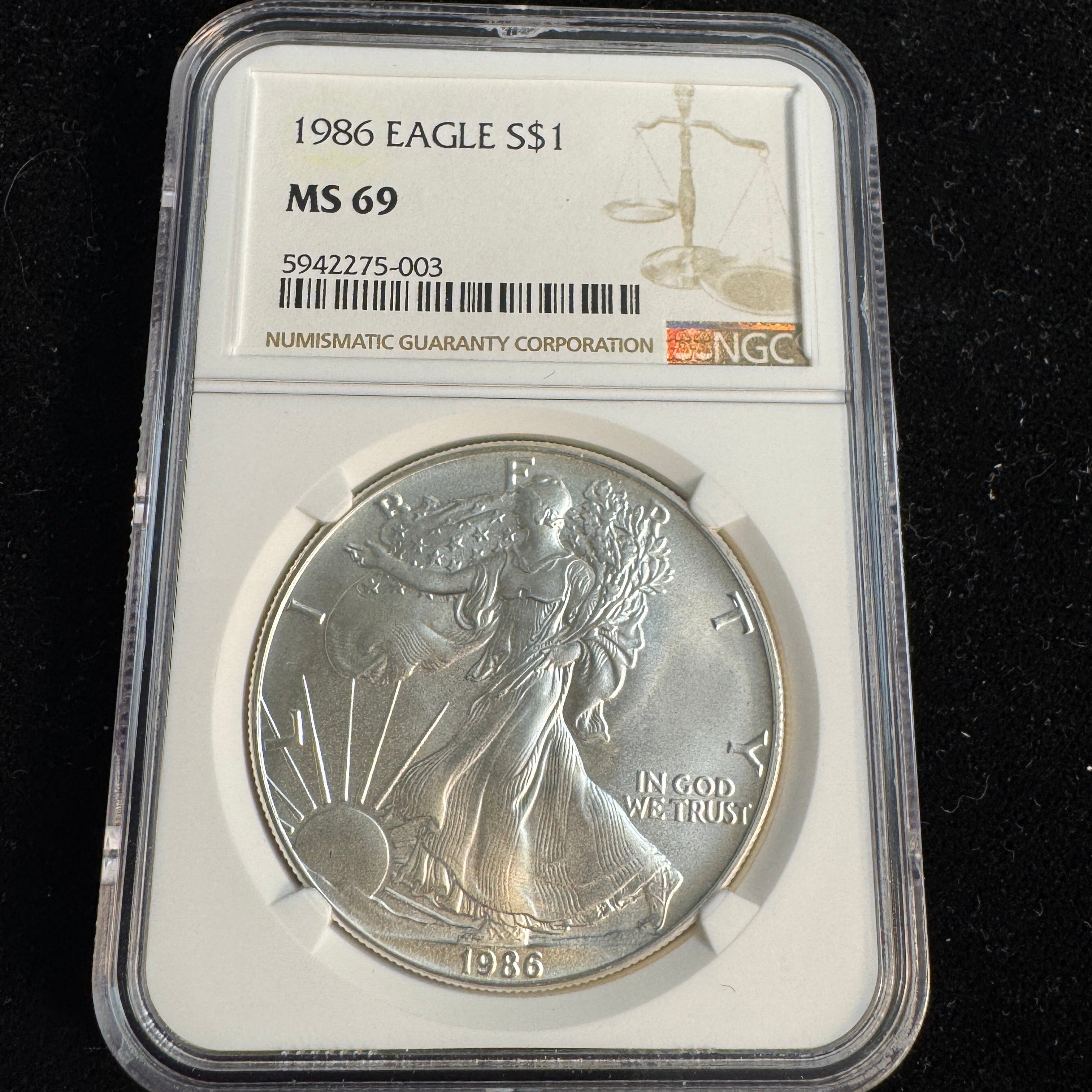 1986 US Silver Eagle $1, NGC MS-69 (CPG: $130)
