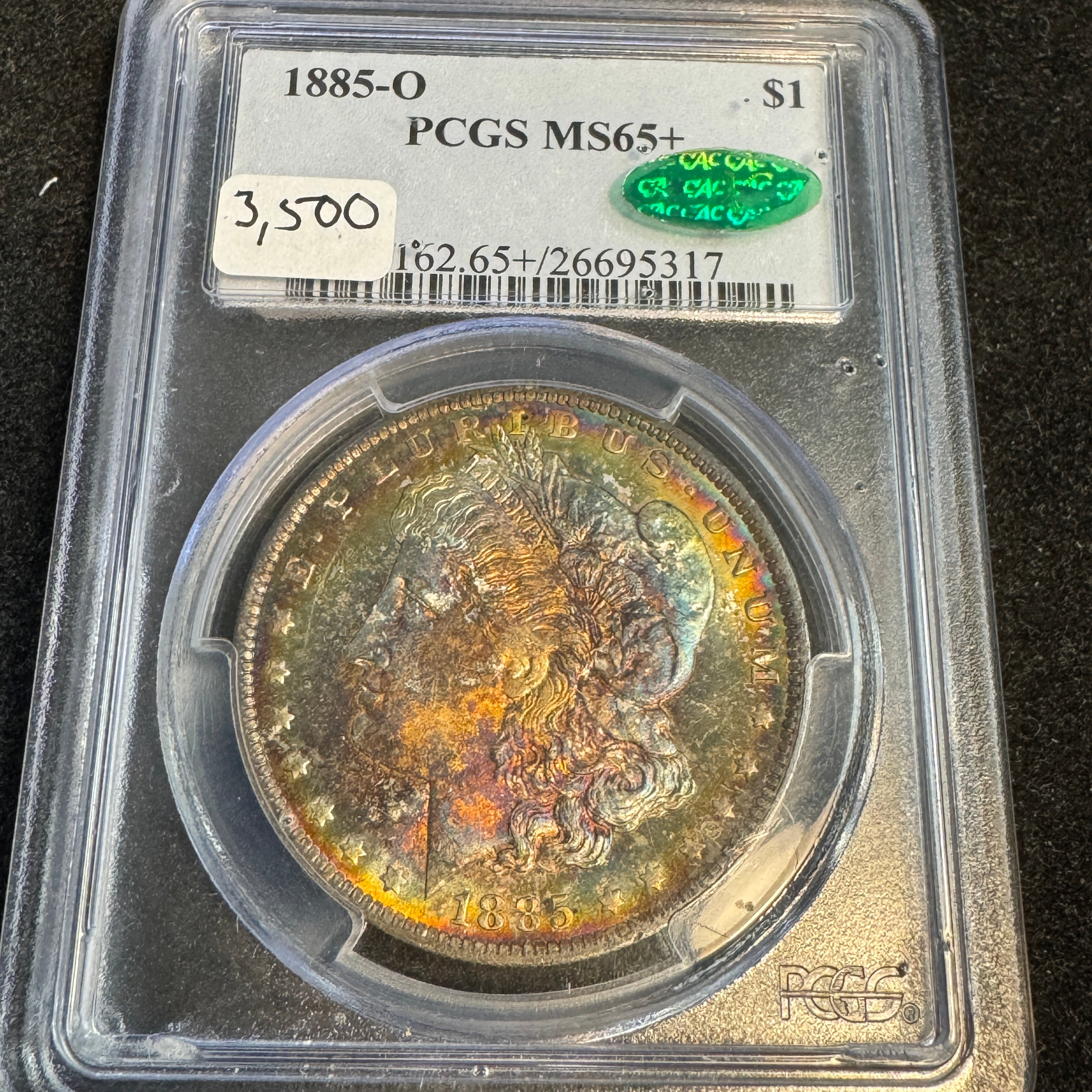 1885-O Morgan Silver Dollar, Rainbow Toned, PCGS MS-65+ Green CAC approved