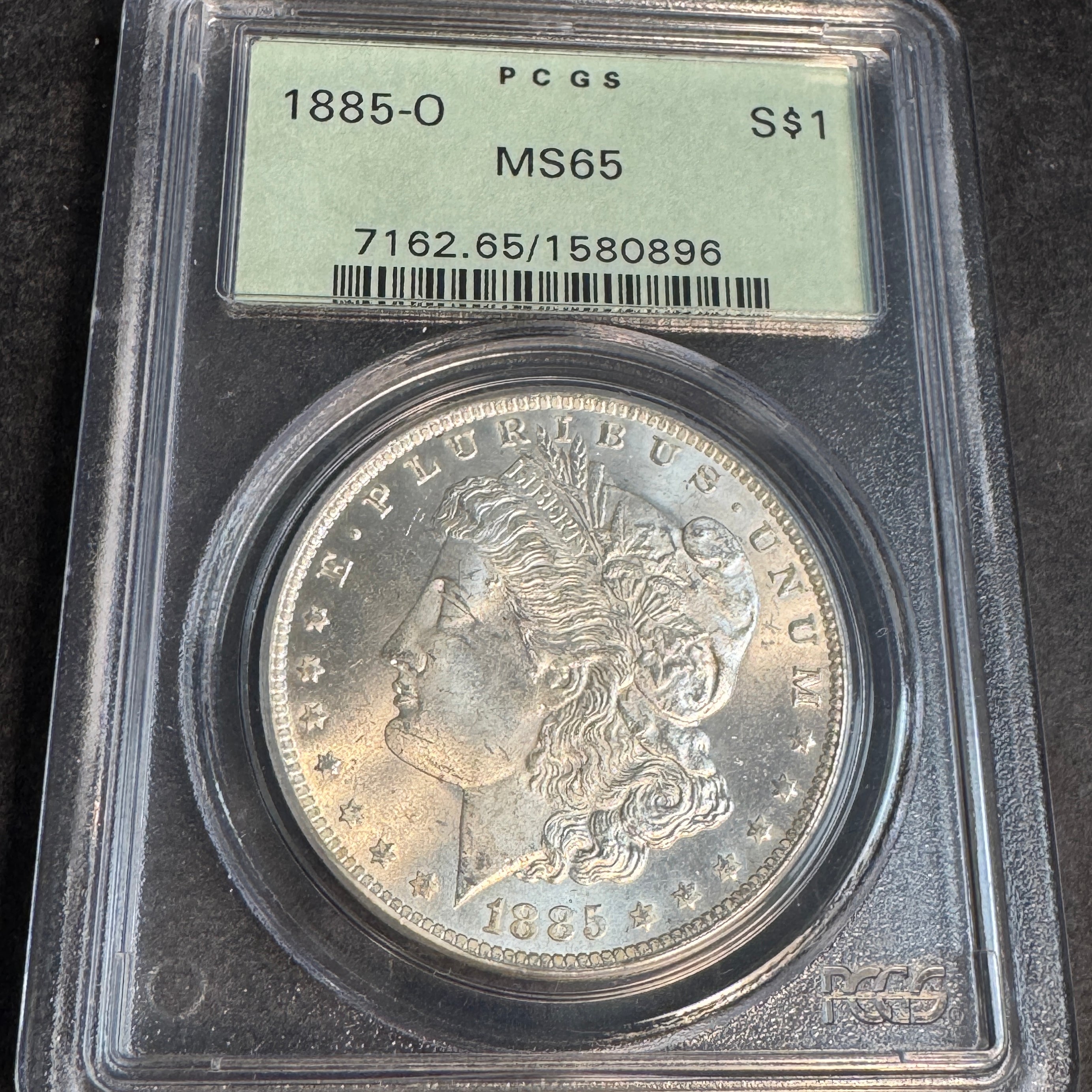 1885-O Morgan Silver Dollar, OGH PCGS MS-65