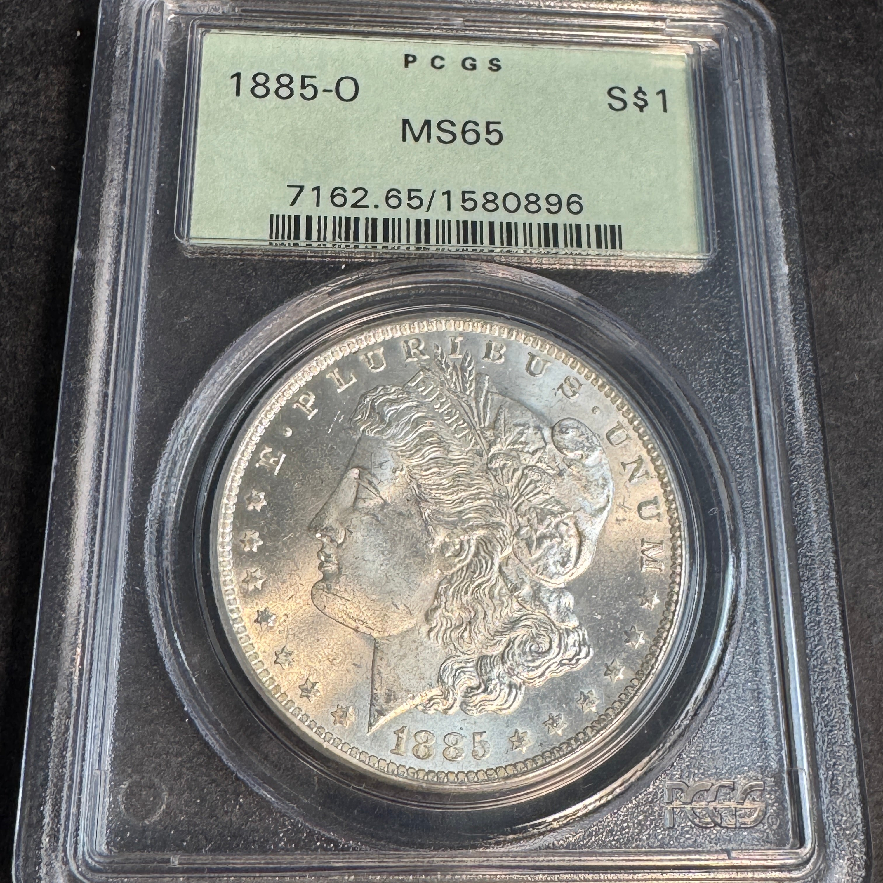 1885-O Morgan Silver Dollar, OGH PCGS MS-65