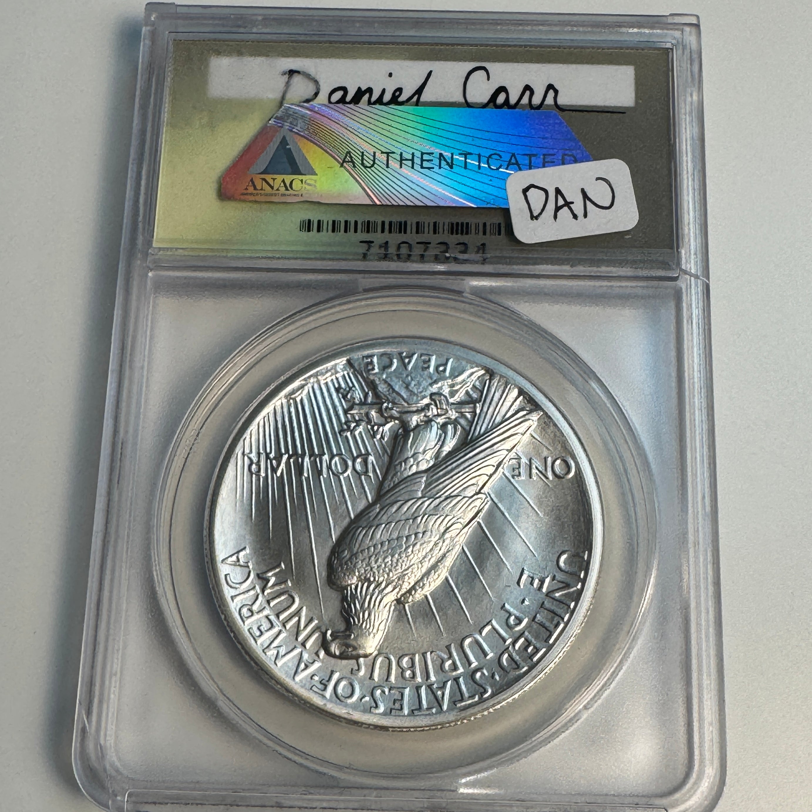 “1920” Daniel Carr Broken Sword Peace Dollar O/S on US Peace Dollar (1922-35) Host, ANACS MS-70