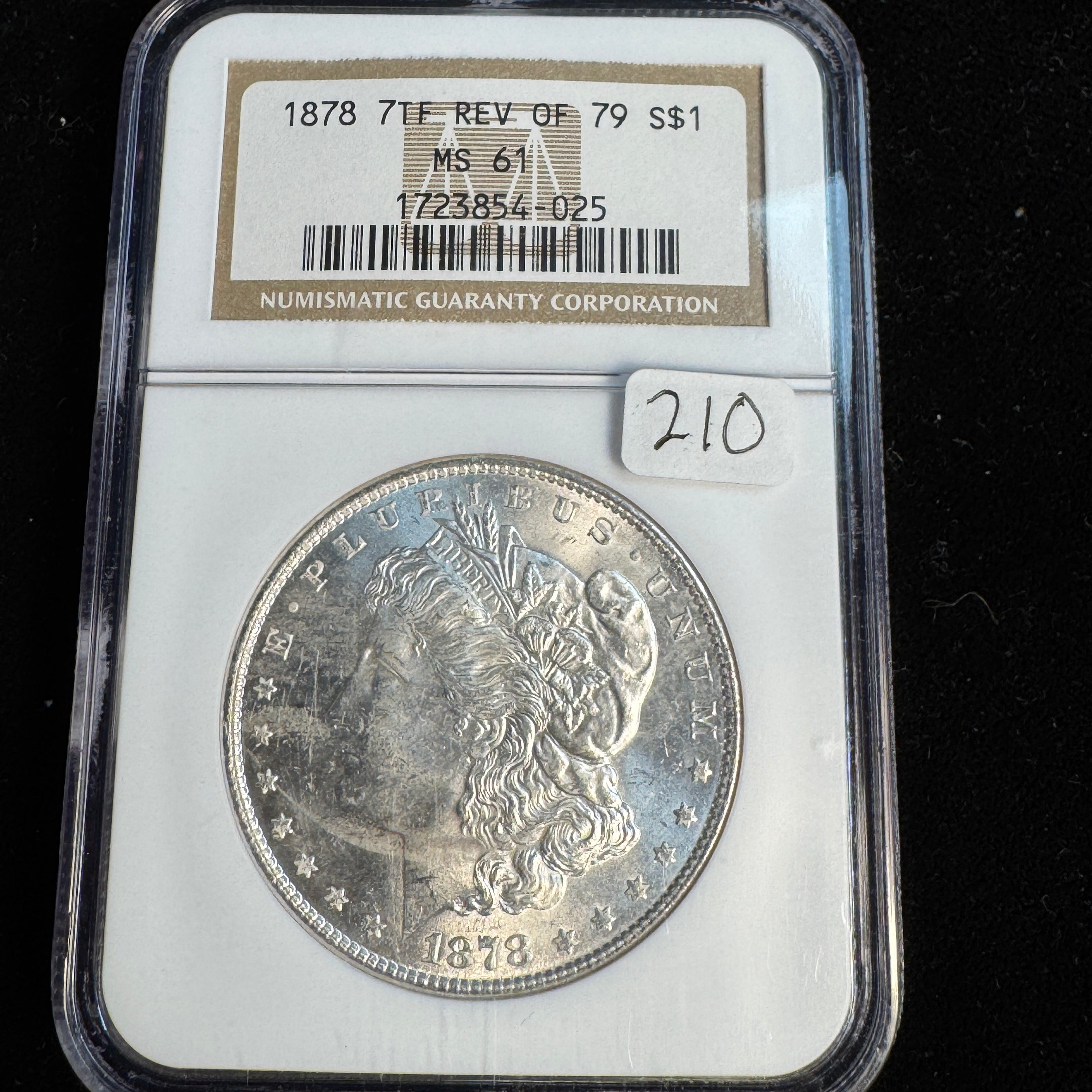 1878 7-TF Rev of ‘79 Morgan Silver Dollar, NGC MS-61