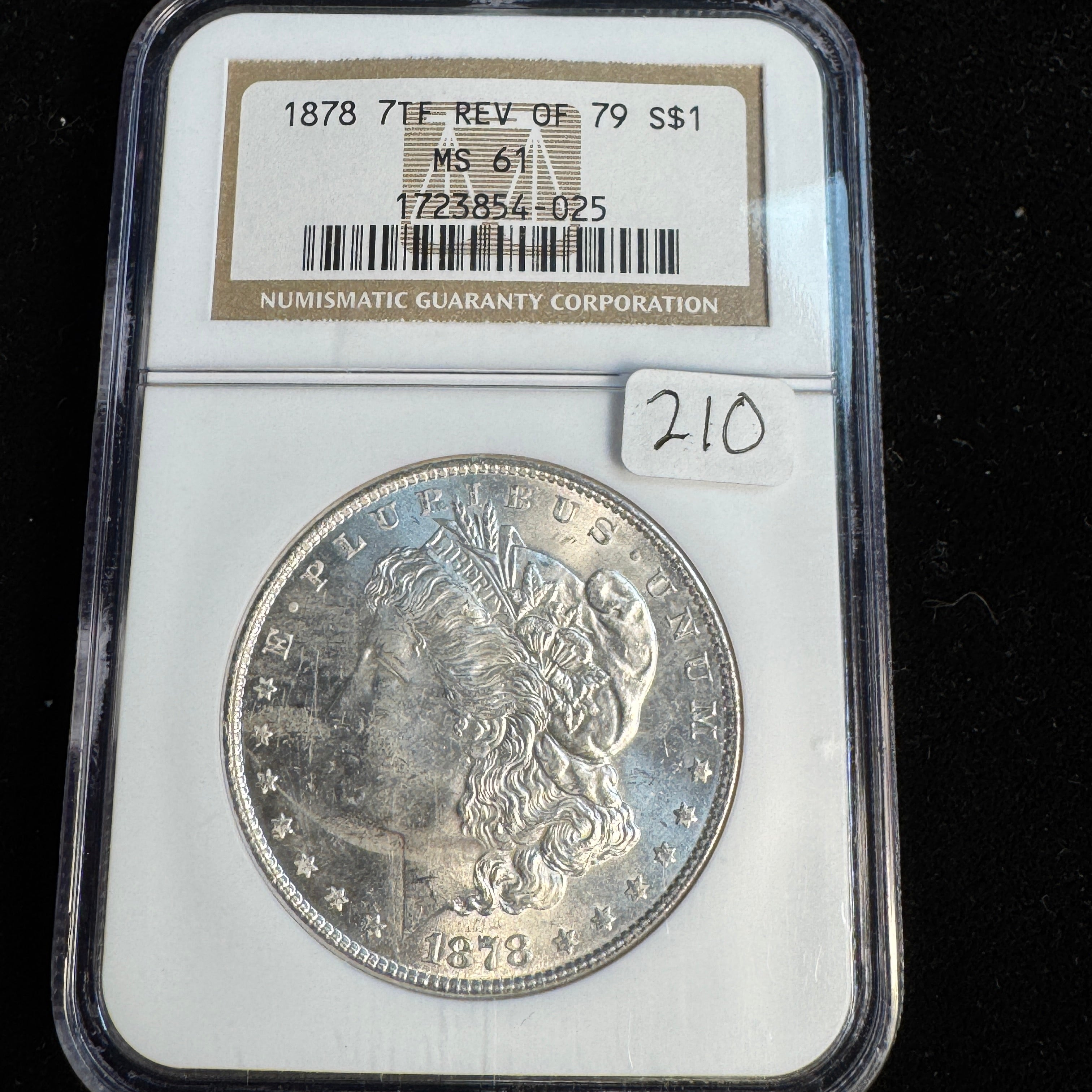1878 7-TF Rev of ‘79 Morgan Silver Dollar, NGC MS-61