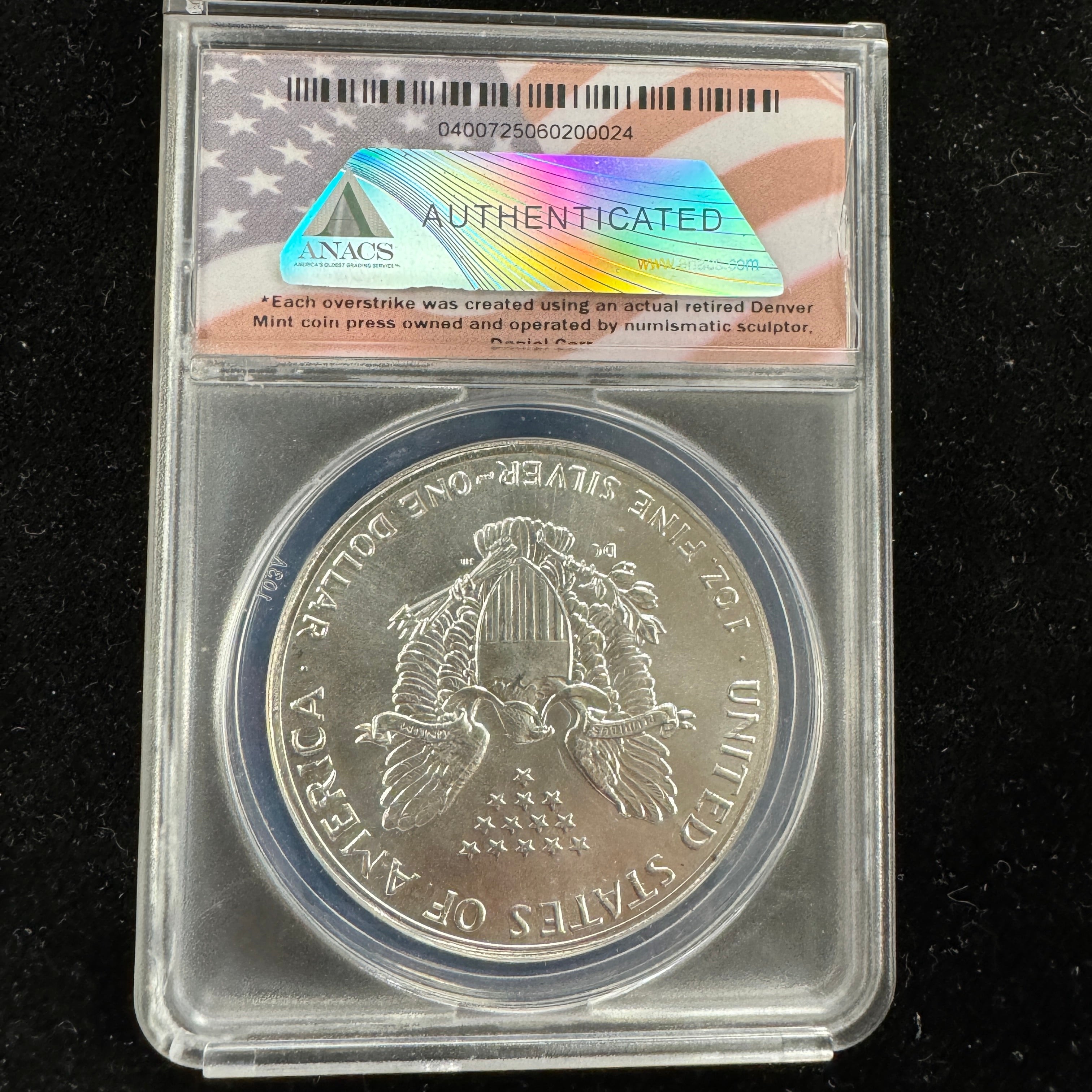 MCMLXXXVI (1986) Daniel Carr Overstruck ASE Design, US Silver Eagle, ANACS MS-69