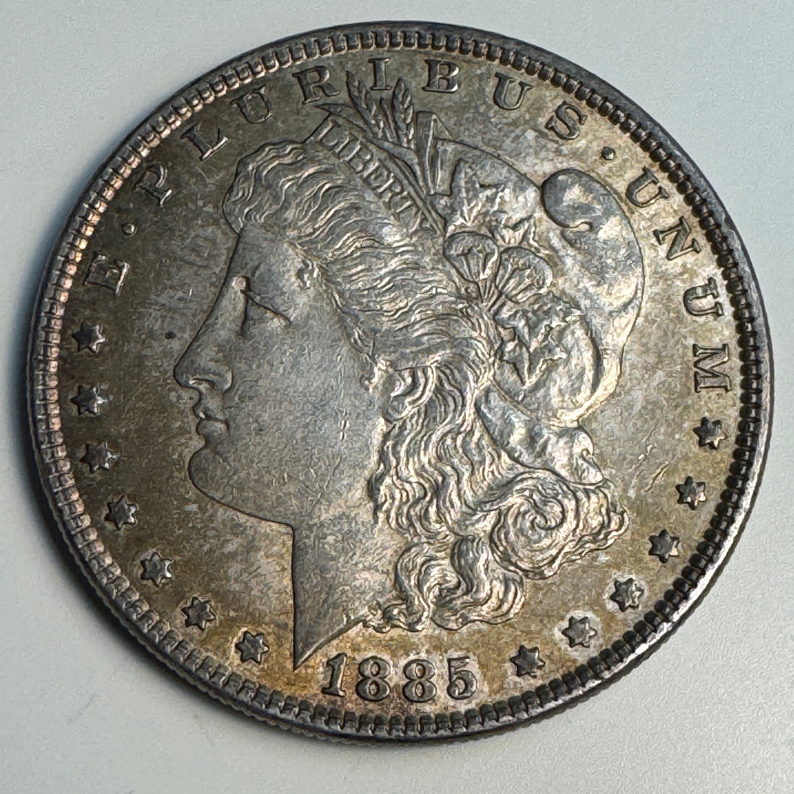 1885 Morgan Silver Dollar, AU w/patina
