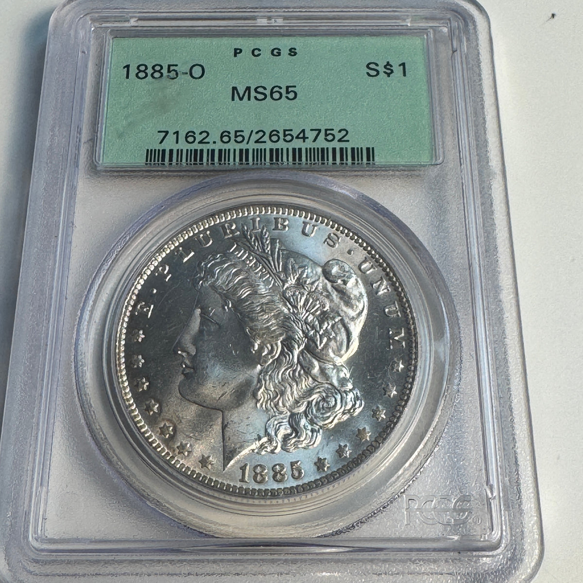 1885-O Morgan Silver Dollar, OGH PCGS MS-65